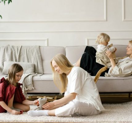 A family enjoys quality time together in a modern living room, promoting warmth and connection.