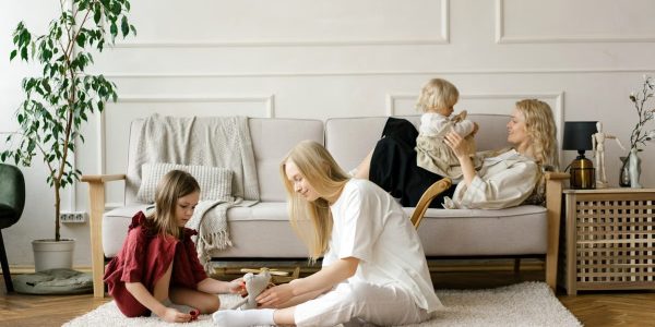 A family enjoys quality time together in a modern living room, promoting warmth and connection.