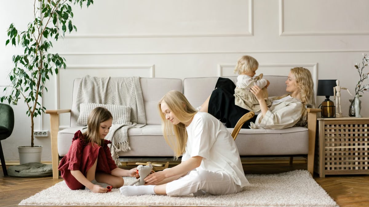 A family enjoys quality time together in a modern living room, promoting warmth and connection.